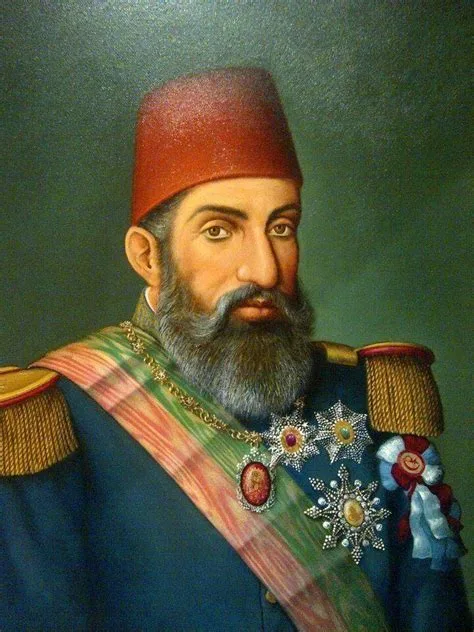 Sultan Abdul-Hamid Khan wearing a Ottoman red hat and with badge of valiant battle victory honor image.